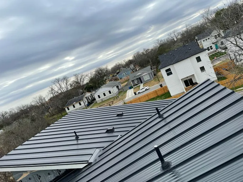 Standing seam metal roof panels with vents for Skylight Repair in Mineola